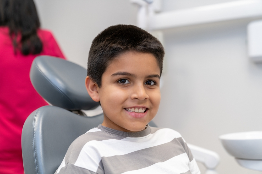 kid smiling at dentist